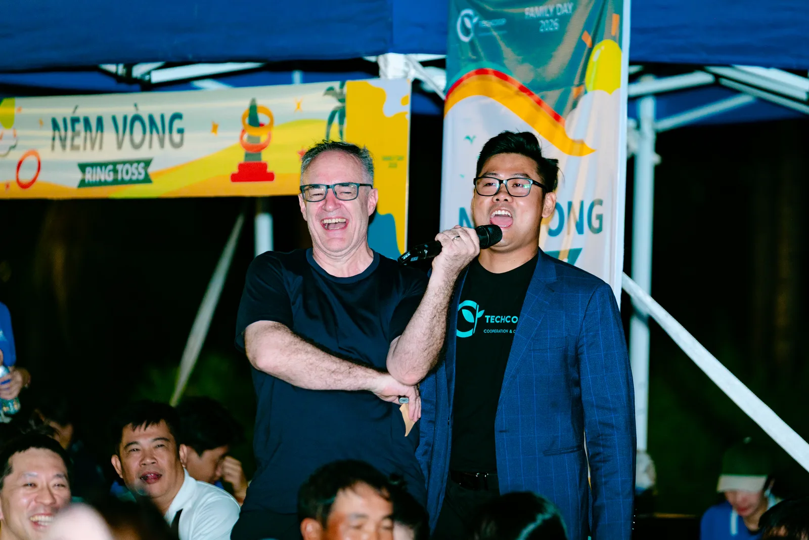 TechCoop colleagues speaking and performing at an event