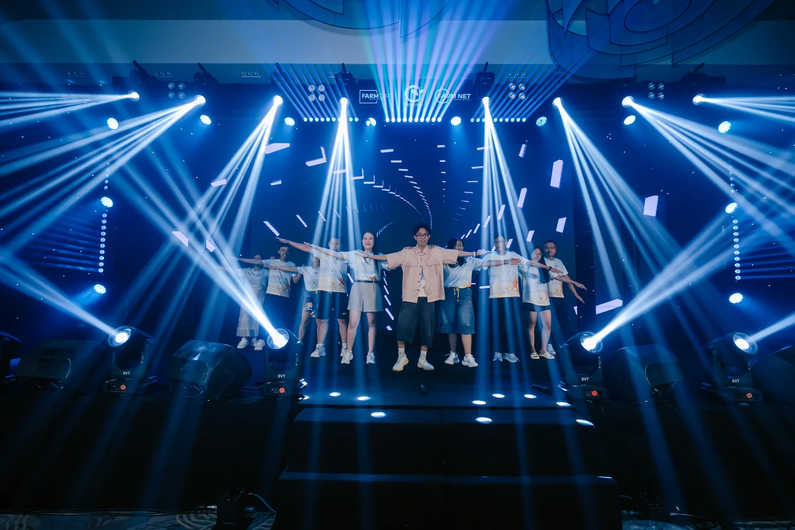 TechCoop colleagues performing on stage at a company event