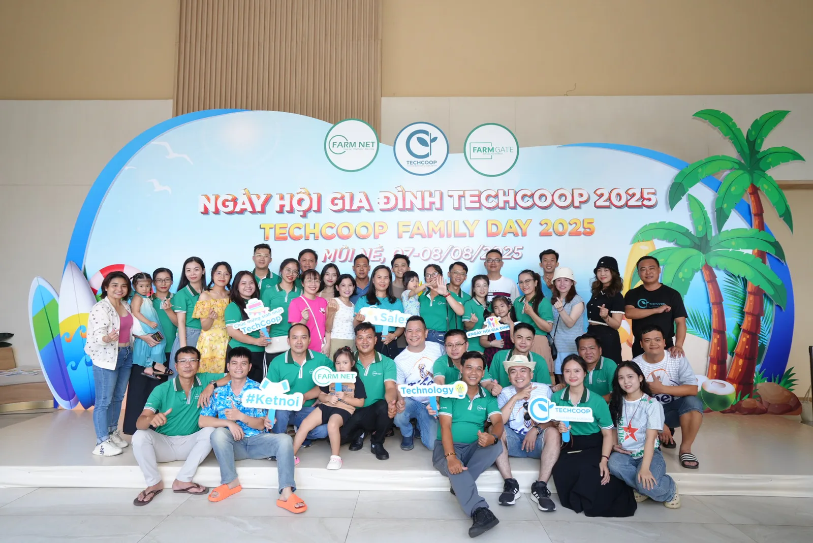 A large group of TechCoop colleagues gathered at a company event